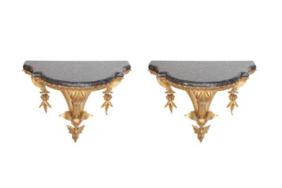 Lot 355 - A PAIR OF CARVED GILTWOOD WALL BRACKETS WITH BLUE PEARL GRANITE TOPS, LATE 19TH TO EARLY 20TH CENTURY