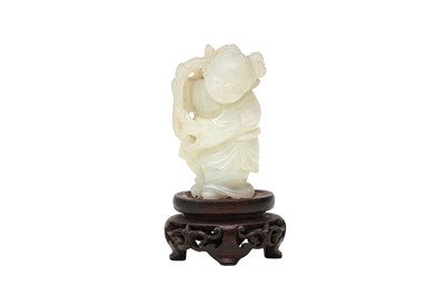 Lot 309 - A CHINESE PALE CELADON JADE CARVING OF A BOY