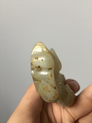 Lot 311 - A CHINESE PALE CELADON JADE FIGURE OF A SAGE