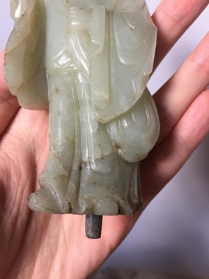 Lot 310 - A CHINESE PALE CELADON JADE FIGURE OF A MONK