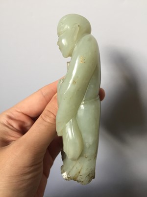 Lot 310 - A CHINESE PALE CELADON JADE FIGURE OF A MONK