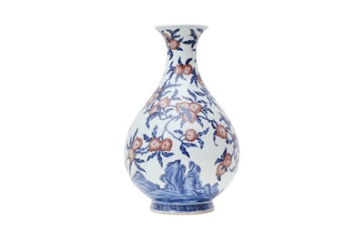 Lot 422 - A CHINESE BLUE AND WHITE AND COPPER RED 'PEACHES' VASE, YUHUCHUNPING.