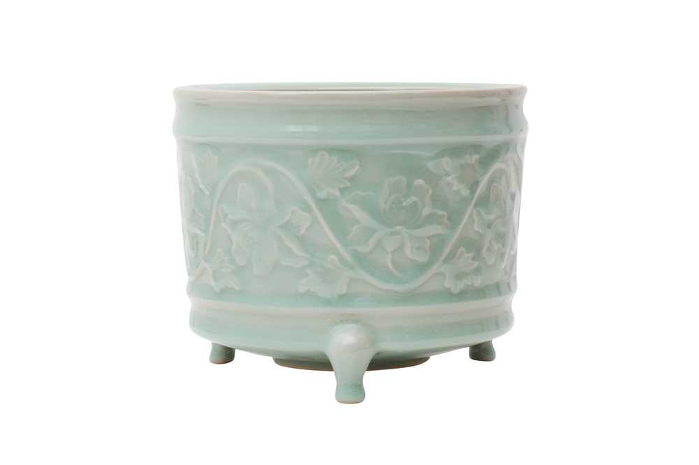 Lot 256 - A CHINESE CELADON-GLAZED 'LOTUS' INCENSE BURNER.