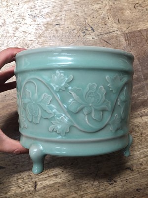 Lot 256 - A CHINESE CELADON-GLAZED 'LOTUS' INCENSE BURNER.