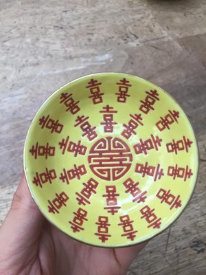 Lot 175 - TWO CHINESE YELLOW-GROUND 'CHARACTERS' SAUCERS.