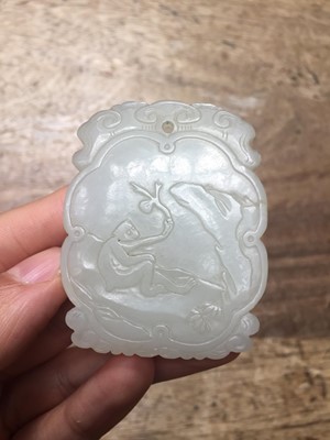 Lot 14 - A CHINESE WHITE JADE PLAQUE AND A JADEITE CARVING.