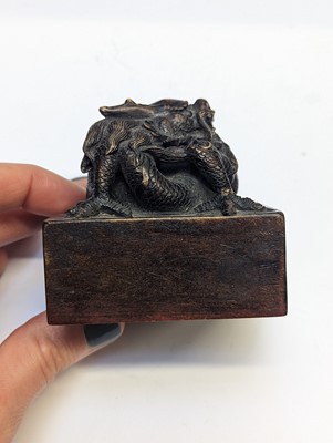 Lot 107 - A CHINESE WOOD 'DRAGON' SEAL.