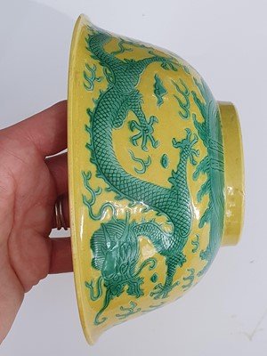 Lot 277 - A CHINESE YELLOW-GROUND 'DRAGON' BOWL.