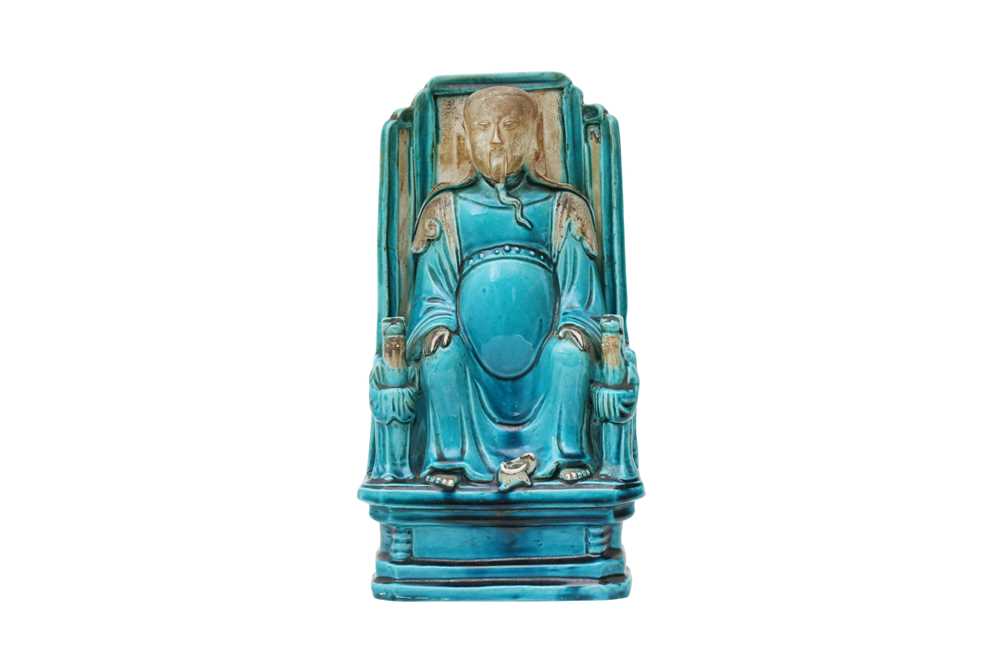 Lot 50 - A TURQUOISE GLAZED FIGURE OF AN IMMORTAL.