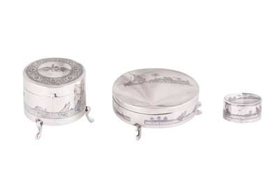 Lot 668 - THREE IRAQI SILVER AND NIELLO DRESSING TABLE BOXES WITH RIVER SCENES