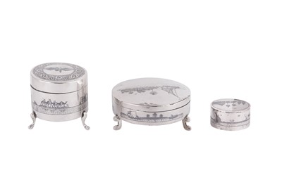 Lot 668 - THREE IRAQI SILVER AND NIELLO DRESSING TABLE BOXES WITH RIVER SCENES