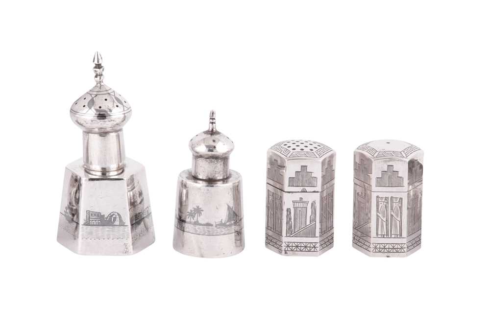 Lot 672 - A PERSIAN ENGRAVED SILVER AND AN IRAQI SILVER AND NIELLO FOUR-PIECE CRUET SET