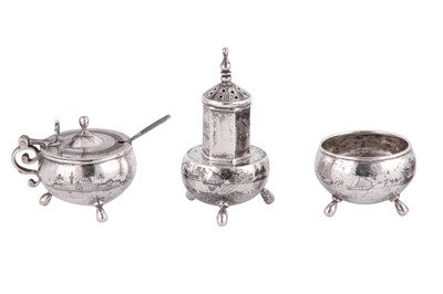 Lot 673 - AN IRAQI SILVER AND NIELLO THREE-PIECE CRUET SET