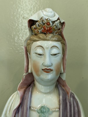 Lot 85 - A CHINESE ENAMEL-DECORATED DEHUA FIGURE OF GUANYIN