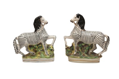 Lot 422 - A PAIR OF 20TH CENTURY STAFFORDSHIRE MODELS OF ZEBRAS
