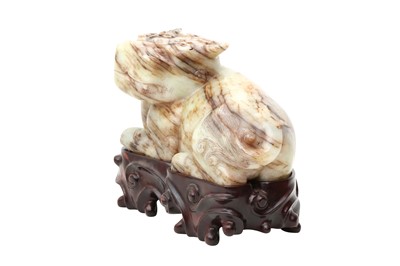 Lot 307 - A CHINESE PALE CELADON JADE 'MYTHICAL BEAST' CARVING