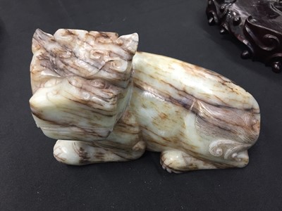 Lot 307 - A CHINESE PALE CELADON JADE 'MYTHICAL BEAST' CARVING