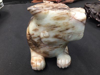 Lot 307 - A CHINESE PALE CELADON JADE 'MYTHICAL BEAST' CARVING