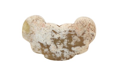 Lot 38 - A CHINESE PALE CELADON JADE 'ARCHAISTIC MASK' PENDANT.