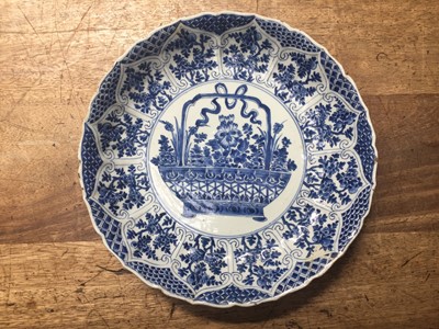 Lot 94 - A CHINESE BLUE AND WHITE 'FLOWER BASKET' DISH.