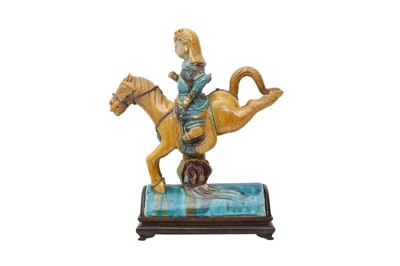 Lot 127 - A CHINESE POLYCHROME-GLAZED 'HORSE AND RIDER' ROOF TILE.