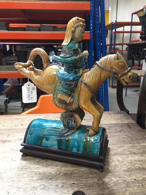 Lot 127 - A CHINESE POLYCHROME-GLAZED 'HORSE AND RIDER' ROOF TILE.