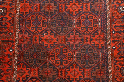 Lot 69 - AN ANTIQIUE BALOUCH RUG, NORTH-EAST PERSIA