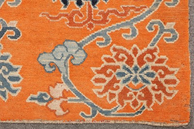 Lot 71 - AN ANTIQUE TIBETAN RUG