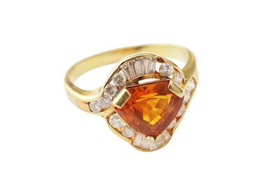 Lot 102 - A sapphire and diamond dress ring