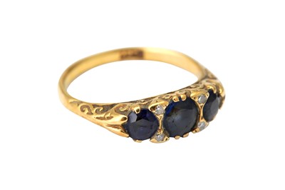 Lot 17 - A sapphire and diamond three stone ring