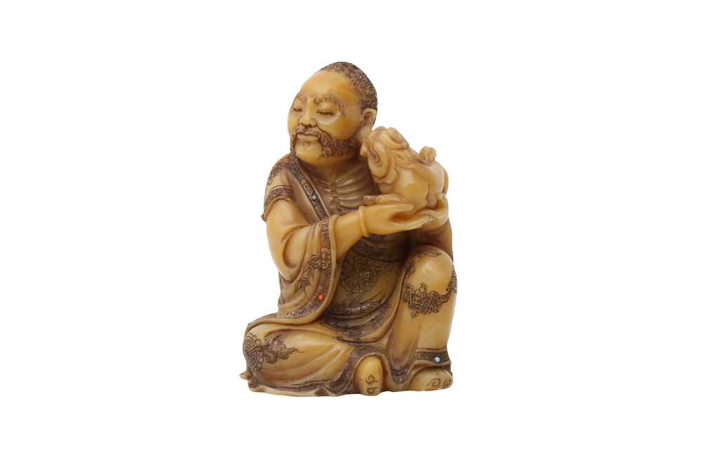 Lot 37 - A CHINESE SOAPSTONE CARVING OF A LUOHAN.
