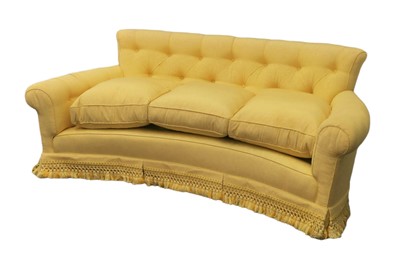 Lot 279 - A YELLOW UPHOLSTERED TWO SEATER SOFA OF CURVED FORM