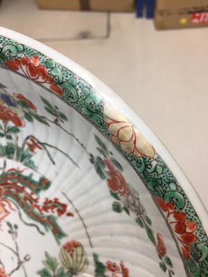 Lot 53 - A CHINESE FAMILLE VERTE RIBBED 'PHOENIX AND PEONIES' BOWL.