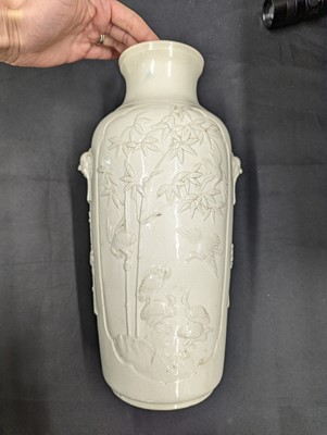 Lot 69 - A CHINESE MOULDED DEHUA 'GOATS AND CRANES' VASE.