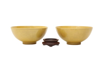 Lot 480 - A PAIR OF CHINESE YELLOW-GLAZED 'DRAGON' BOWLS.