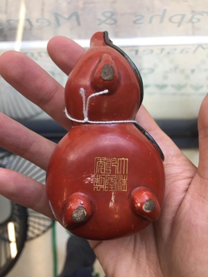 Lot 41 - A CHINESE CORAL-GLAZED DOUBLE GOURD WATER DROPPER.