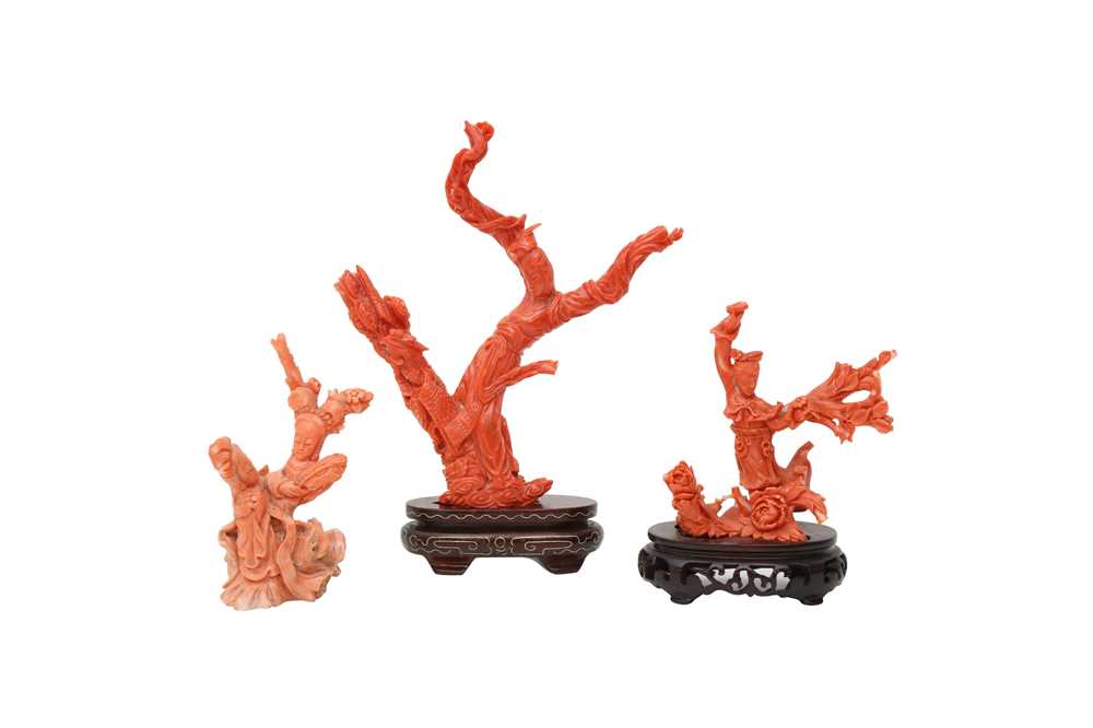 Lot 39 - λ THREE CHINESE CORAL 'IMMORTAL MAIDENS' CARVINGS.