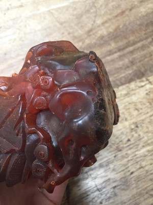 Lot 40 - A CHINESE AMBER 'IMMORTALS' CARVING.