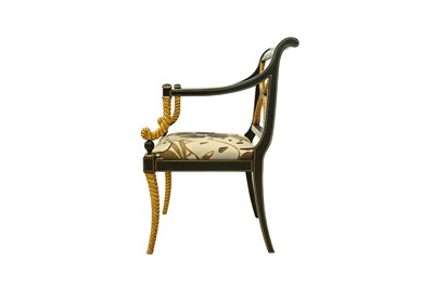Lot 299 - AN EMPIRE STYLE EBONISED AND PARCEL GILT OPEN ARMCHAIR, CONTEMPORARY