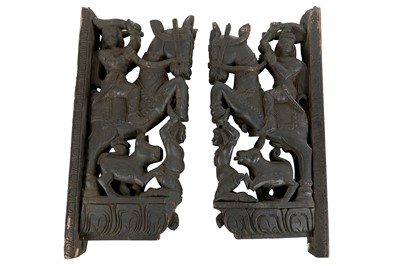 Lot 209 - A PAIR OF INDIAN CARVED AND EBONISED HARDWOOD TEMPLE MOUNTS, PROBABLY SOUTHERN INDIAN