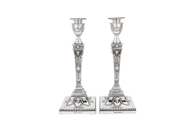 Lot 596 - A pair of Victorian sterling silver candlesticks, Birmingham 1890 by Elkington and Co