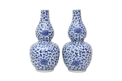 Lot 157 - A PAIR OF CHINESE BLUE AND WHITE DOUBLE GOURD 'LOTUS SCROLL' VASES