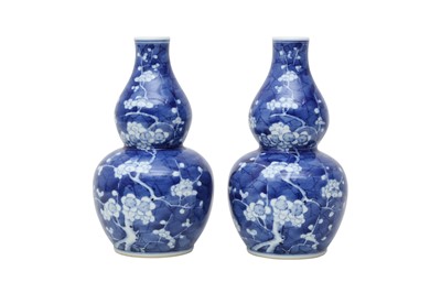 Lot 188 - A PAIR OF CHINESE BLUE AND WHITE DOUBLE GOURD VASES.