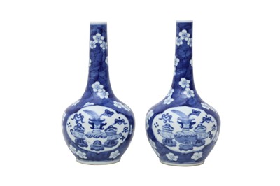 Lot 189 - A PAIR OF CHINESE BLUE AND WHITE 'TREASURES' BOTTLE VASES.