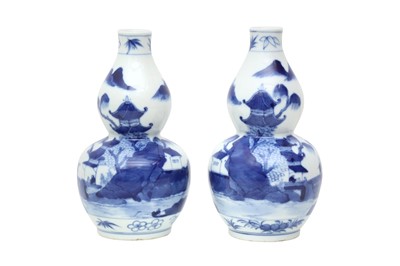Lot 344 - A PAIR OF CHINESE BLUE AND WHITE DOUBLE GOURD 'LANDSCAPE' VASES.