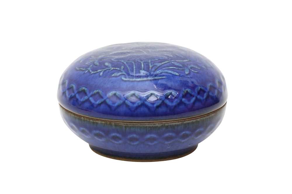 Lot 196 - A CHINESE BLUE-GLAZED 'LOTUS' CIRCULAR BOX AND COVER.