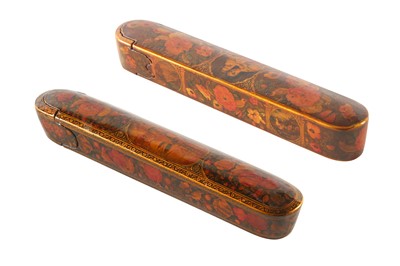 Lot 36 - TWO LACQUERED PAPIER-MÂCHÉ PEN CASES (QALAMDAN) WITH SCENIC VIEWS AND GOL-O-BOLBOL MOTIFS