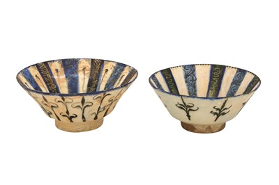 Lot 2 - TWO KASHAN POTTERY BOWLS WITH COBALT BLUE AND WHITE RADIATING BANDS