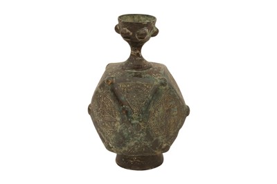 Lot 6 - A SMALL ENGRAVED AND FACETED BRONZE BOTTLE