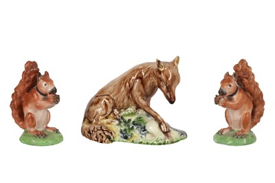 Lot 99 - A PAIR OF STAFFORDSHIRE CREAMWARE SQUIRRELS, RALPH WOOD TYPE